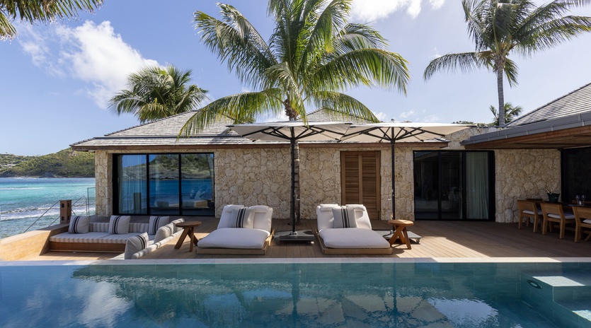 Beachfront luxury villa with private pool and tropical paradise views in a stunning oceanside location.