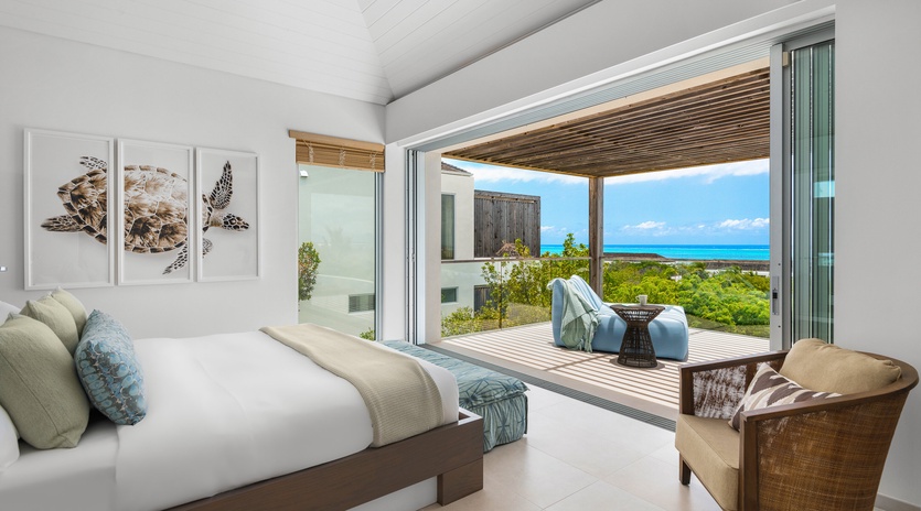 Wake up to stunning ocean views from your private bedroom sanctuary, where tropical breezes flow through open doors to your terrace.
