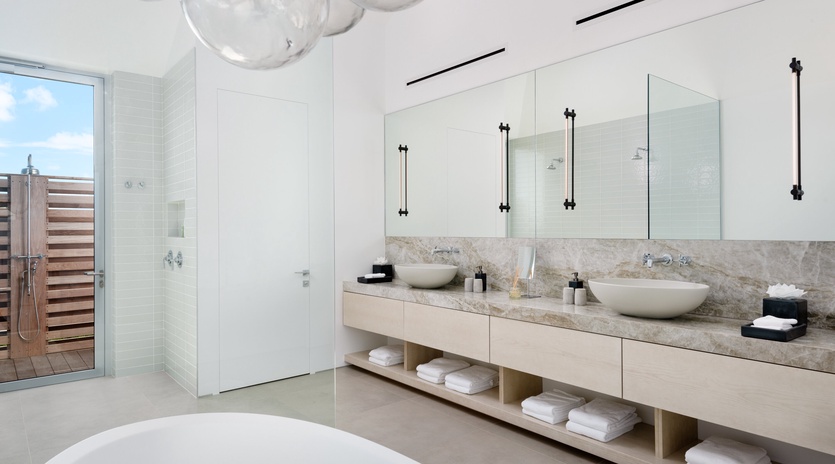Indulge in your private spa-like sanctuary with a soaking tub, dual vanities, and rain shower for pure relaxation.