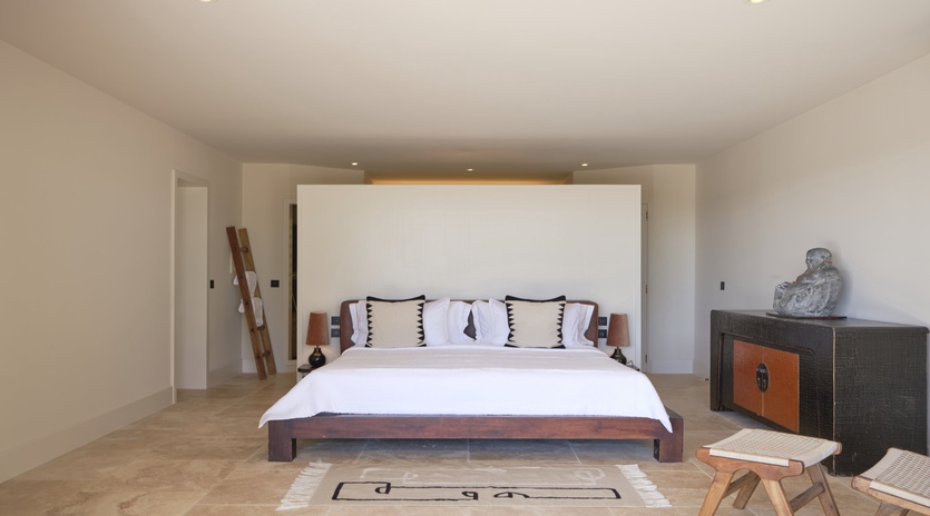 Step into your serene sanctuary with crisp linens, warm wood accents, and thoughtful touches creating the perfect retreat for restful nights.