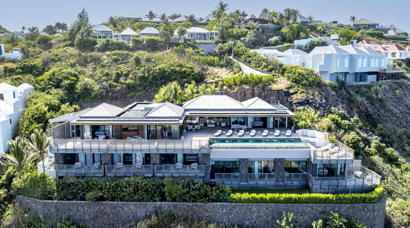 Stunning hillside luxury villa offering panoramic views and complete privacy in an exclusive neighborhood setting.