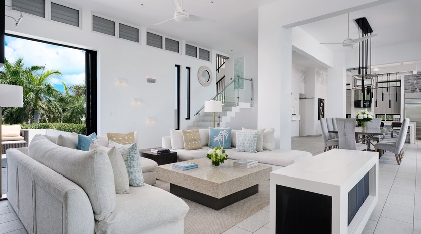 Relax in your bright, open-concept living space with soaring ceilings, plush seating, and tropical garden views—the perfect spot to unwind after a day of adventure.