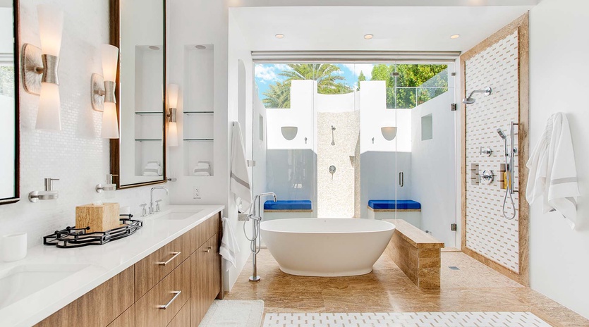 Your private spa-like sanctuary features a luxurious soaking tub, dual vanities, rainfall shower, and an open-air courtyard—modern elegance meets total relaxation.