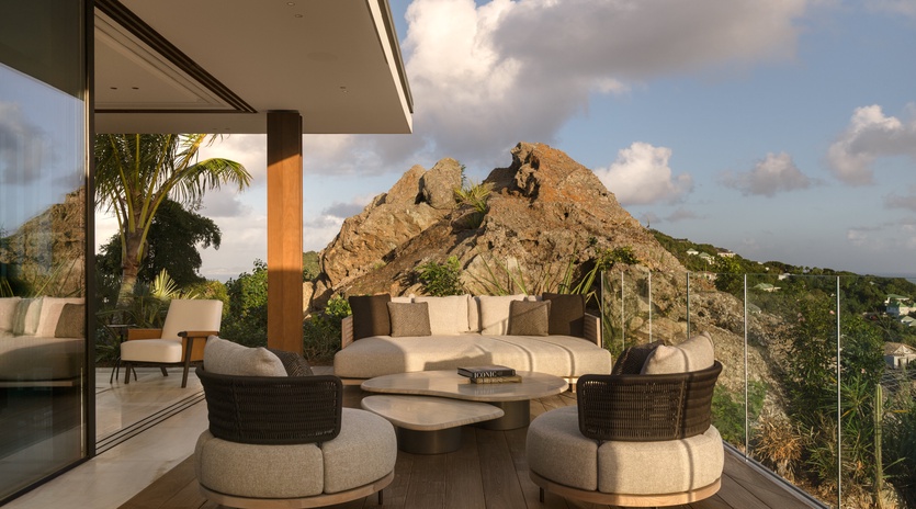 Your private terrace offers plush seating with dramatic rock formations as your backdrop, perfect for evening relaxation.