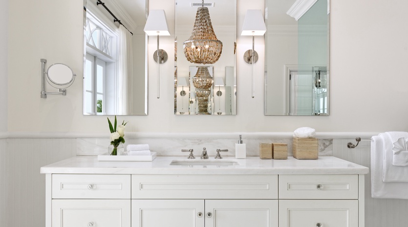 Refresh and rejuvenate in your elegant bathroom, featuring marble countertops, statement chandelier, and thoughtfully curated amenities designed for your comfort.