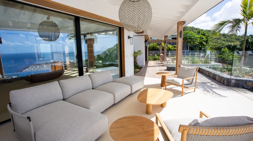 Unwind in your stunning living space with breathtaking ocean views through floor-to-ceiling windows.