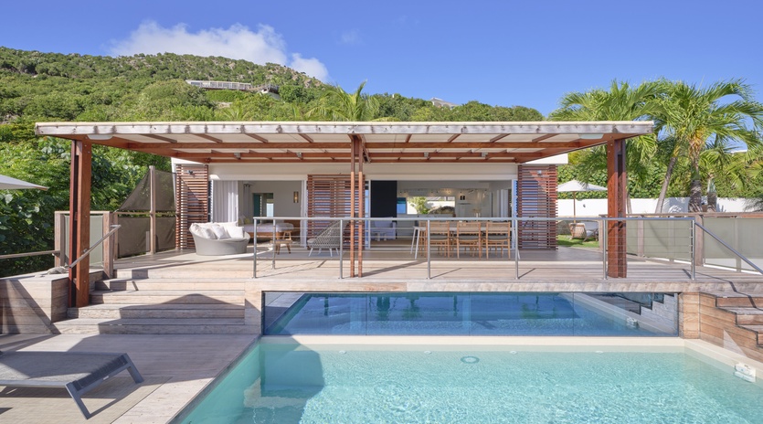 Dive into your private paradise with crystal-clear pool waters and seamless indoor-outdoor living under tropical skies.