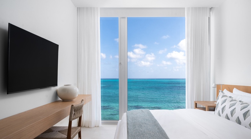 Wake up to stunning ocean views through your private windows, where turquoise waters stretch endlessly beyond your comfortable bedroom retreat.