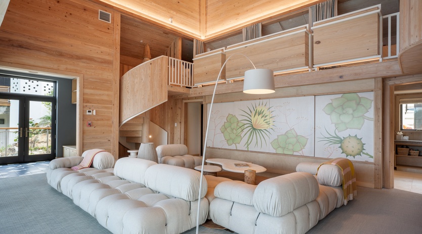 Unwind in your modern loft with plush seating and warm wood throughout, perfect for relaxing after your adventures.