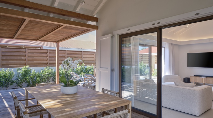 Your private terrace seamlessly flows into the bright living area, creating the perfect indoor-outdoor retreat for dining and relaxing.