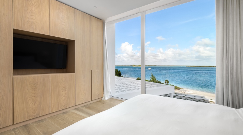 Wake up to breathtaking ocean views from your private bedroom sanctuary, where modern design meets coastal luxury.