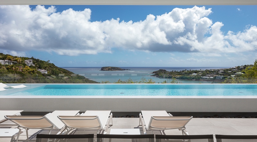 Stunning infinity pool with panoramic ocean views and luxury loungers for the ultimate Caribbean escape.