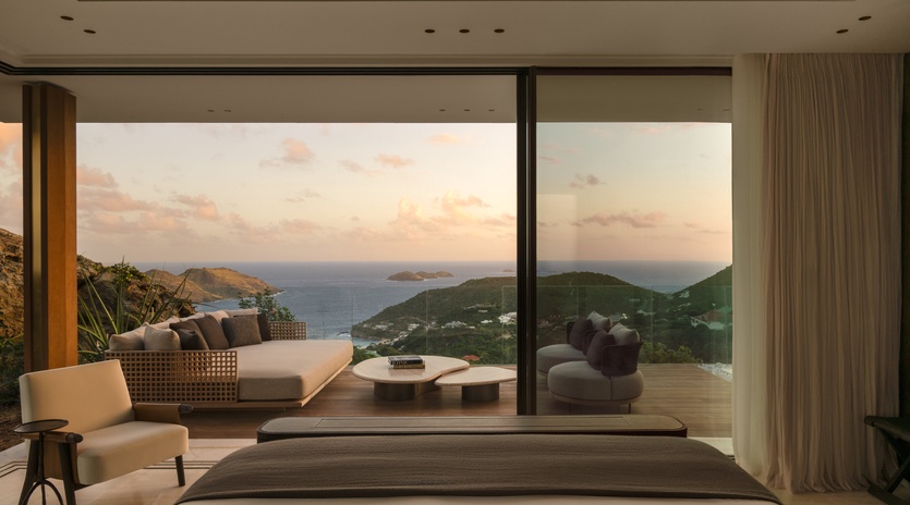 Wake up to breathtaking ocean and mountain views from your luxurious bedroom, where floor-to-ceiling windows frame the perfect Caribbean sunrise.