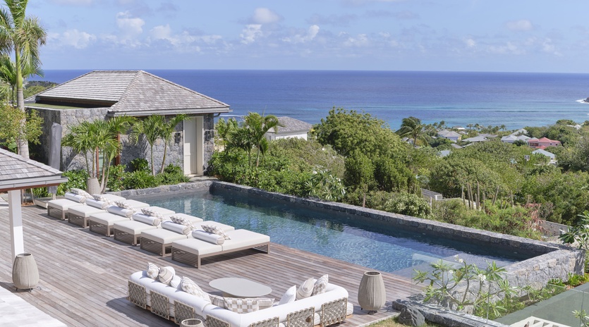 Relax by your private infinity pool with stunning sea views stretching to the horizon from this luxurious tropical retreat.