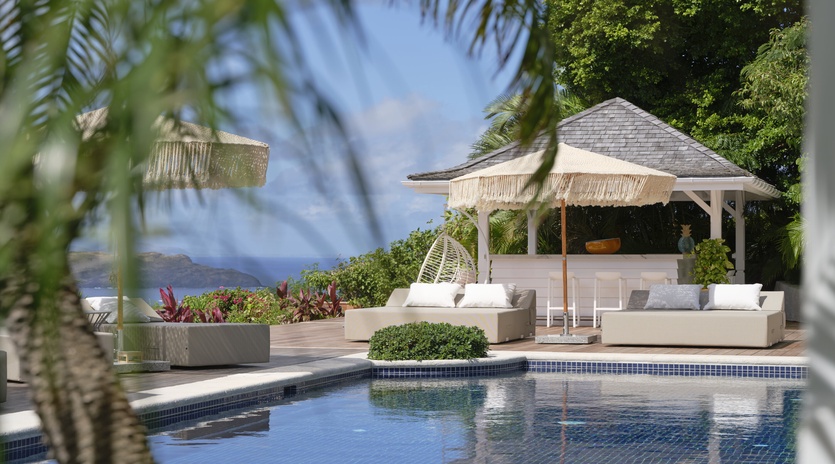 Luxury poolside paradise with tropical elegance and ocean views awaiting your arrival.