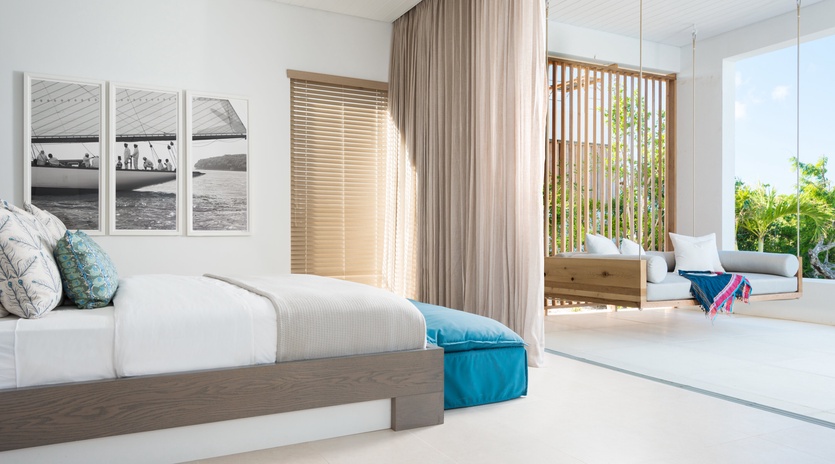 Wake up in your serene bedroom where soft ocean breezes flow through, complete with private balcony seating overlooking tropical gardens.