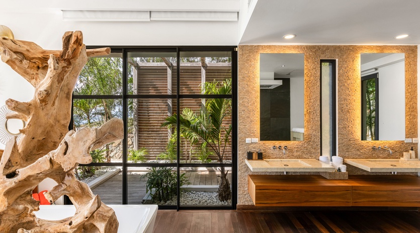 Luxurious bathroom with dual vanities and stunning garden views creates your perfect morning retreat.