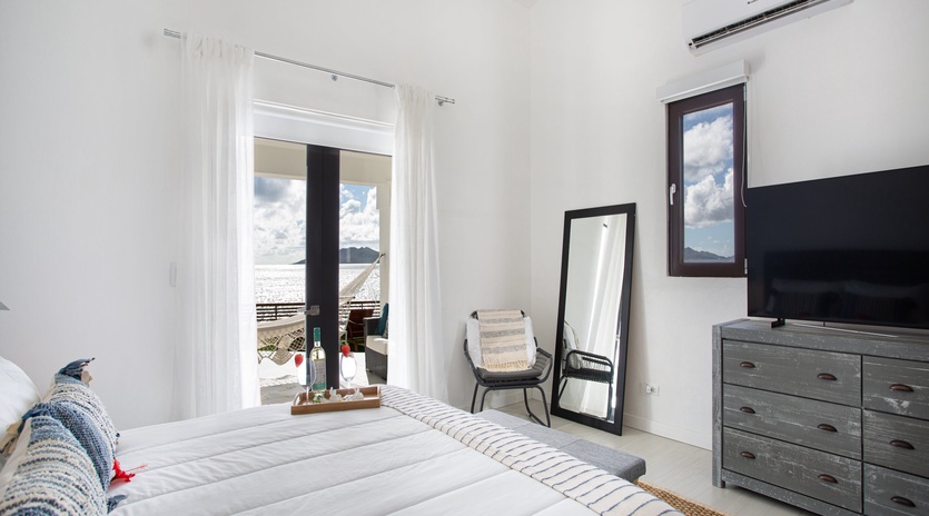 Sunlight streams through your window, highlighting the crisp linens and modern comforts. Step out to your private balcony and let the ocean breeze refresh your senses.