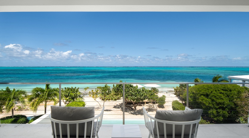 Soak in breathtaking turquoise waters from your private balcony, where modern comfort meets endless ocean views.