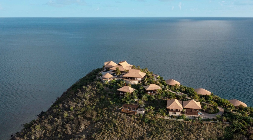 Tropical resort perched on a dramatic clifftop peninsula surrounded by endless ocean views and lush vegetation.
