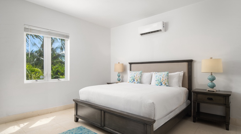 Drift off in this bright, airy bedroom where tropical breezes flow through your window and cool AC keeps you comfortable all night.