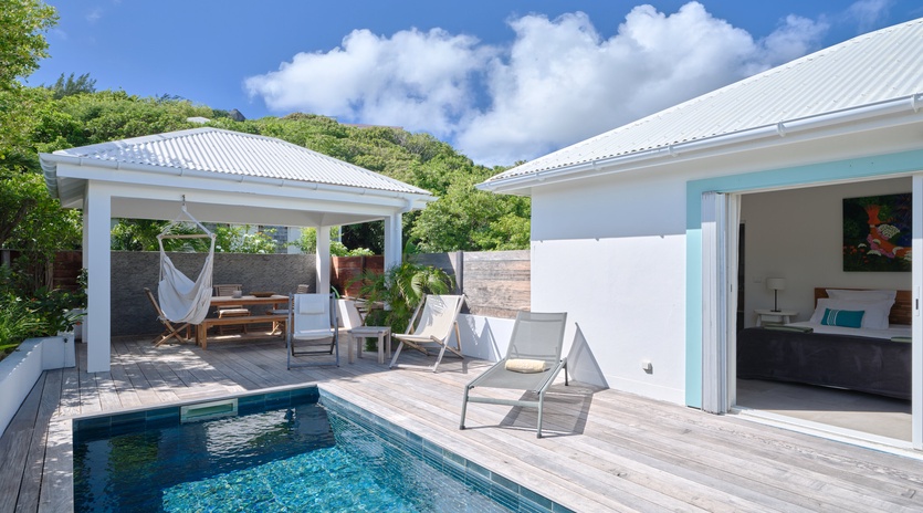 Your private pool oasis awaits with crystal-clear waters, relaxing loungers, and a hammock under your own pergola.