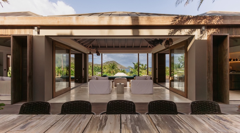 Contemporary tropical villa featuring seamless indoor-outdoor living with stunning mountain views and modern architectural design elements.