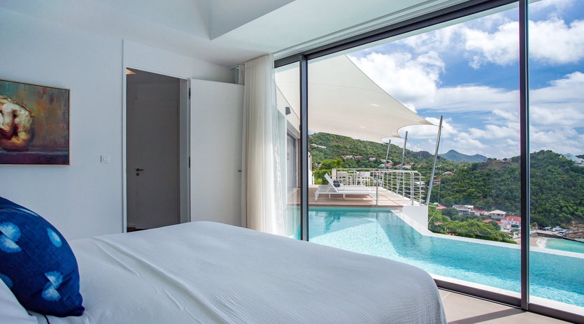Wake up to stunning tropical vistas from your bed, with the infinity pool and lush mountains creating your perfect morning view.
