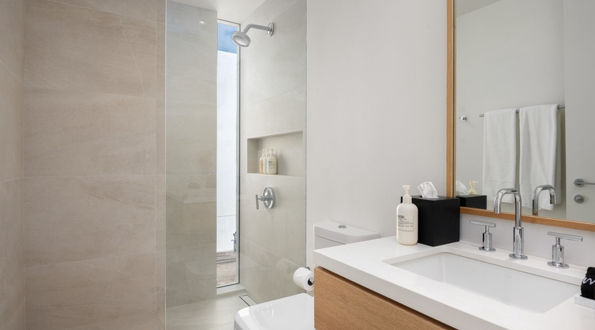 Step into your sleek spa-like bathroom with a spacious walk-in shower, elegant vanity, and premium amenities waiting for your arrival.