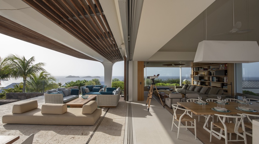 Your spacious retreat seamlessly blends indoor comfort with tropical tranquility, offering panoramic ocean views from every angle.