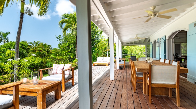 Relax on your private covered terrace with teak furniture, surrounded by lush tropical gardens and swaying palms.