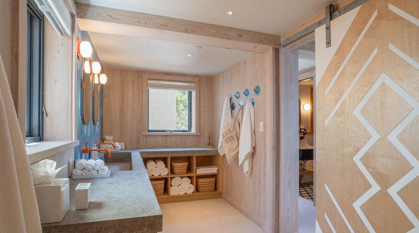 Unwind in your private spa-like bathroom with deep soaking tub, plush robes, and warm wood accents creating the perfect wellness retreat.