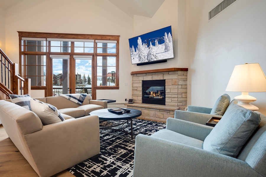 Sink into plush seating by your private fireplace while gazing at mountain views through expansive windows—your perfect après-ski sanctuary awaits.