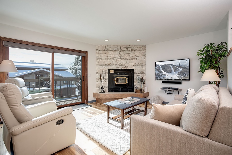 Sink into plush seating by the fireplace and let the mountain views through the patio doors set the tone for your alpine escape.