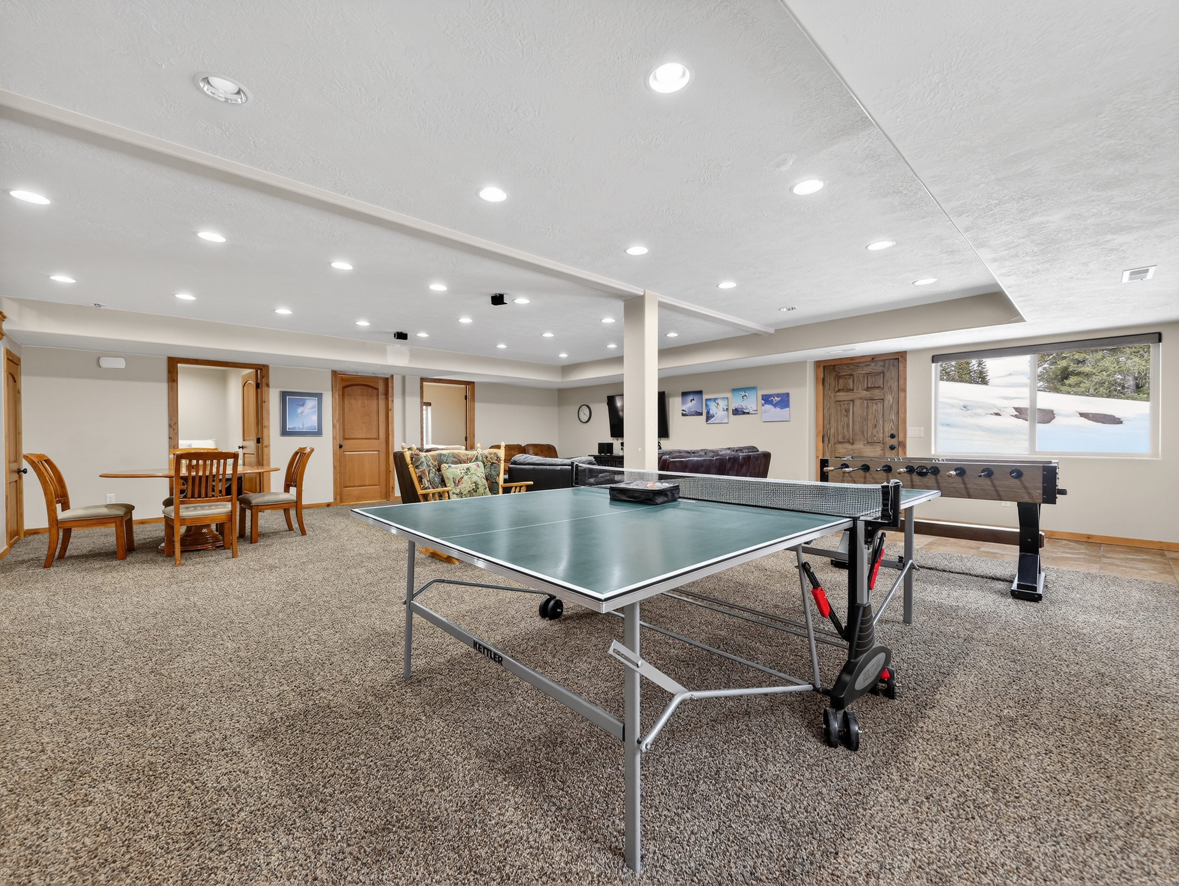 Your private game room awaits with ping pong, foosball, and cozy seating - perfect for friendly competitions and memorable evenings together.