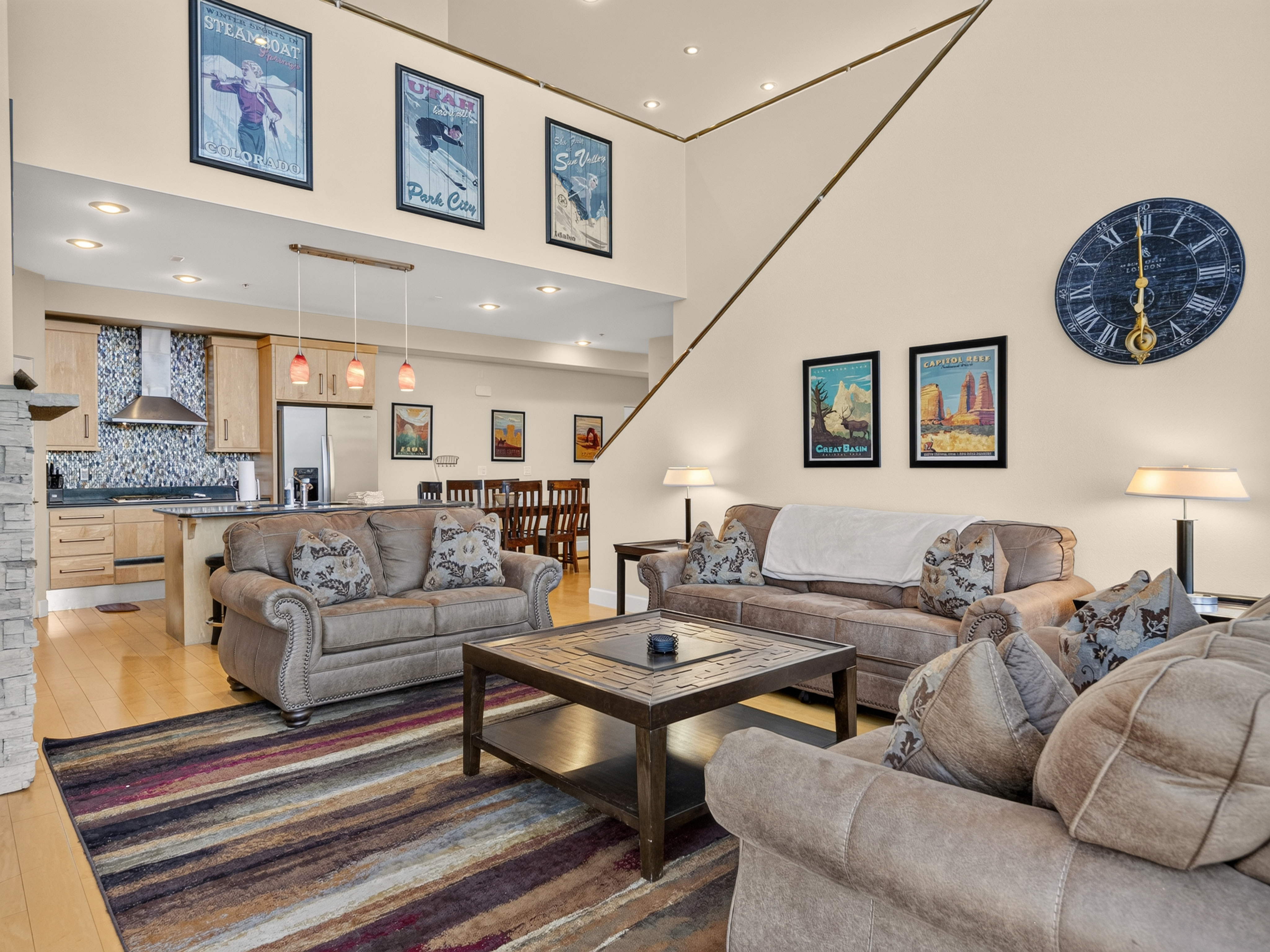 Sink into plush sofas in this bright, open living space where high ceilings and thoughtful touches invite you to unwind after your mountain adventures.