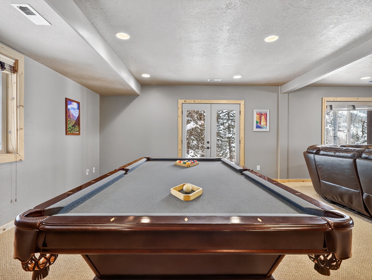 Challenge friends to a game on your private pool table, where cozy evenings become unforgettable memories in your spacious entertainment room.