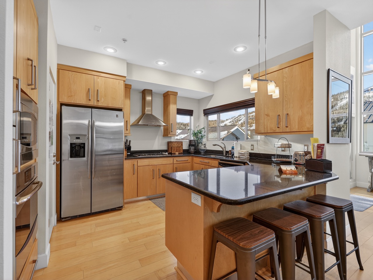 Create memorable meals in your gourmet kitchen with granite counters, stainless steel appliances, and mountain views from every window.