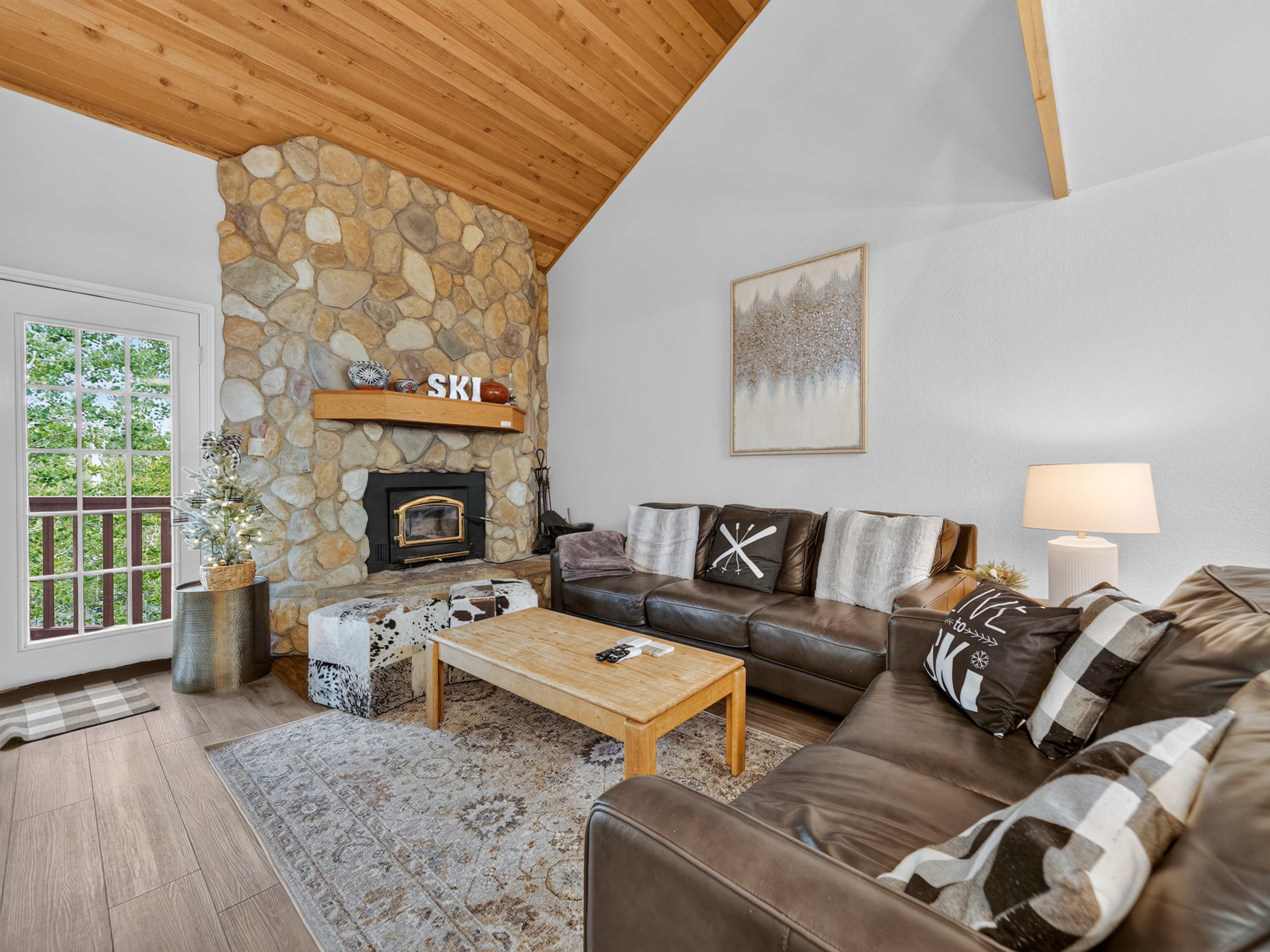 Sink into plush leather couches by the stone fireplace, where soaring wood-paneled ceilings and mountain air create the perfect retreat after a day on the slopes.