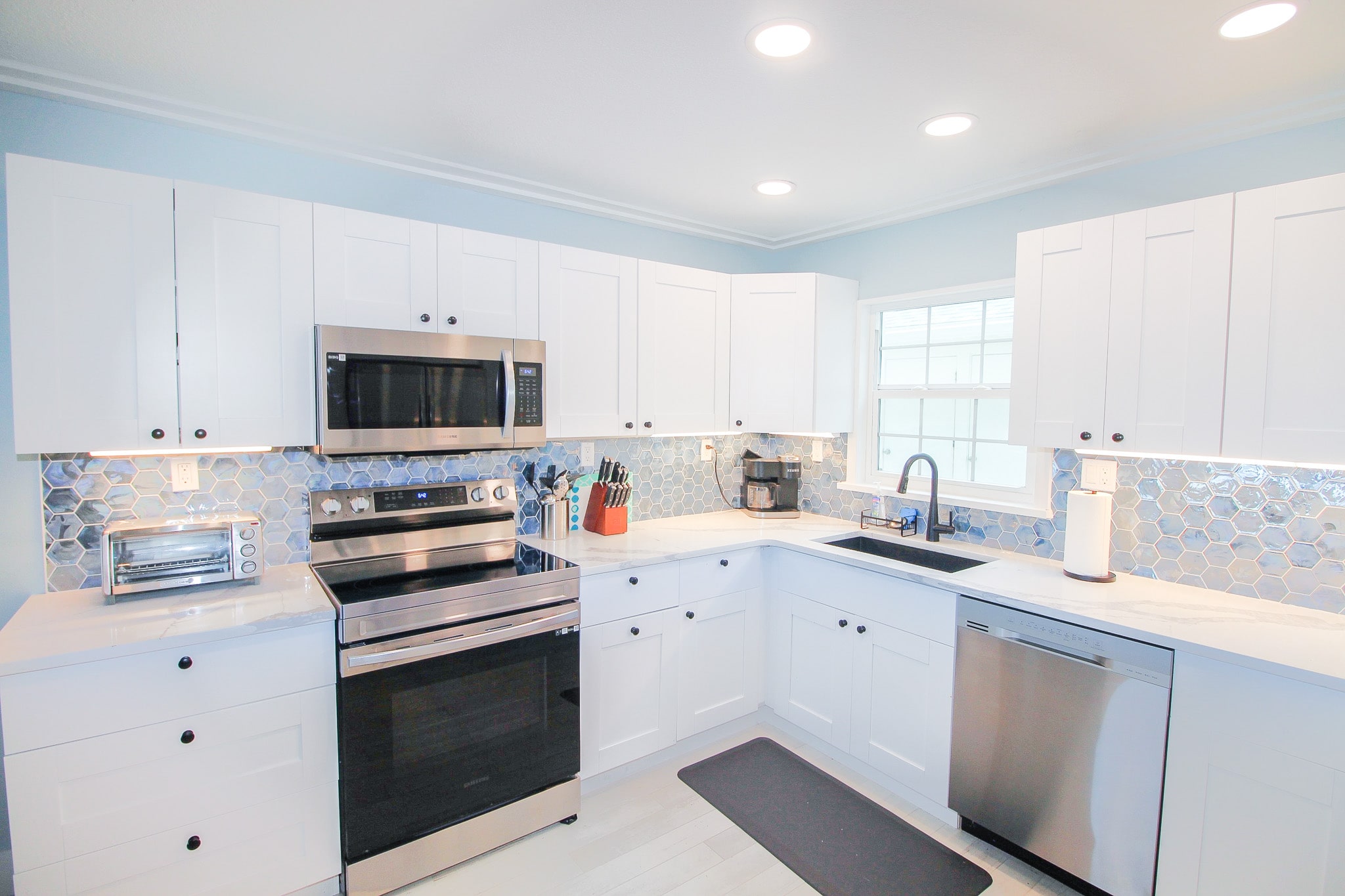 Stainless steel appliances in renovated kitchen