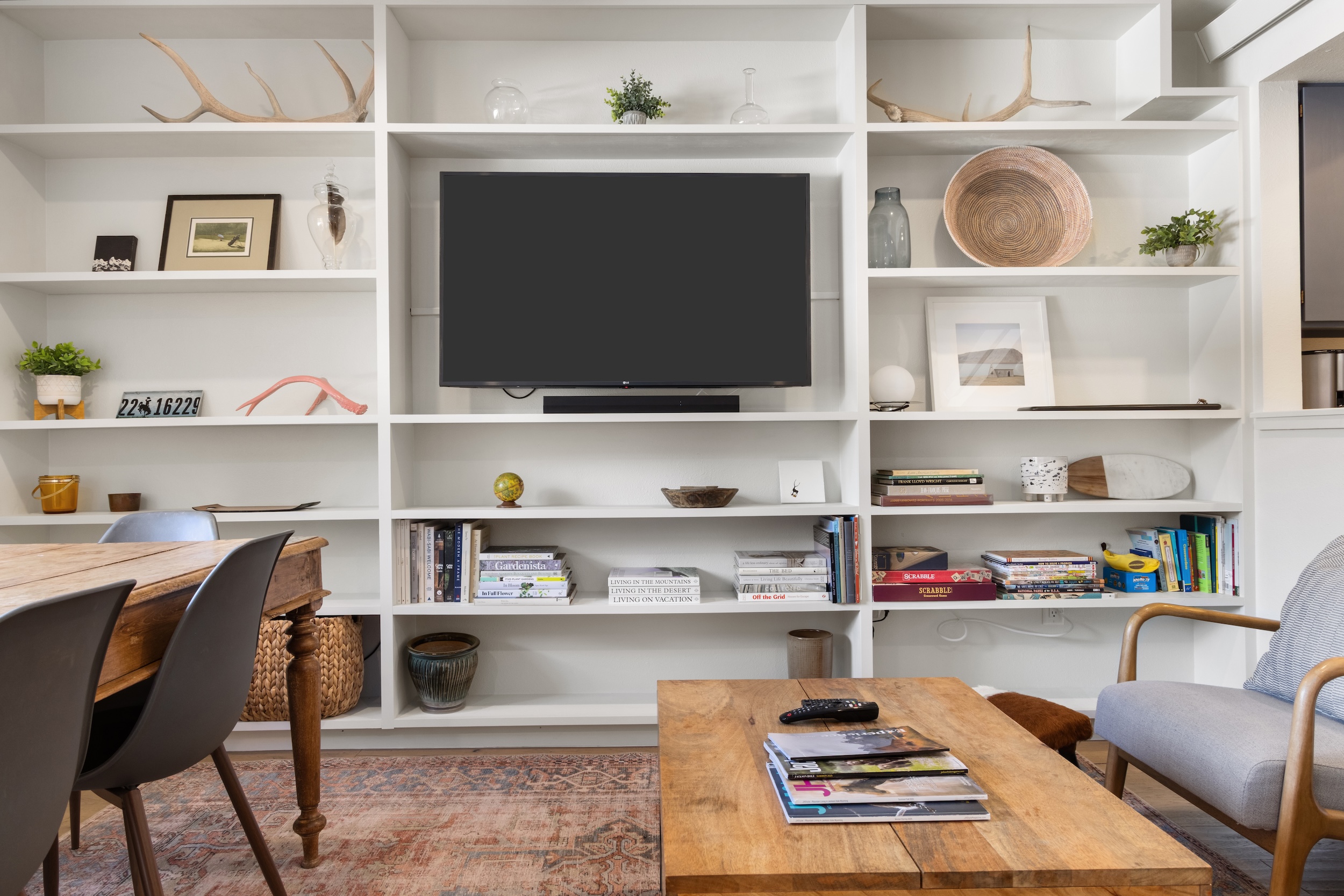Settle into your thoughtfully designed living space with built-in shelving, cozy seating, and entertainment center for perfect relaxation.