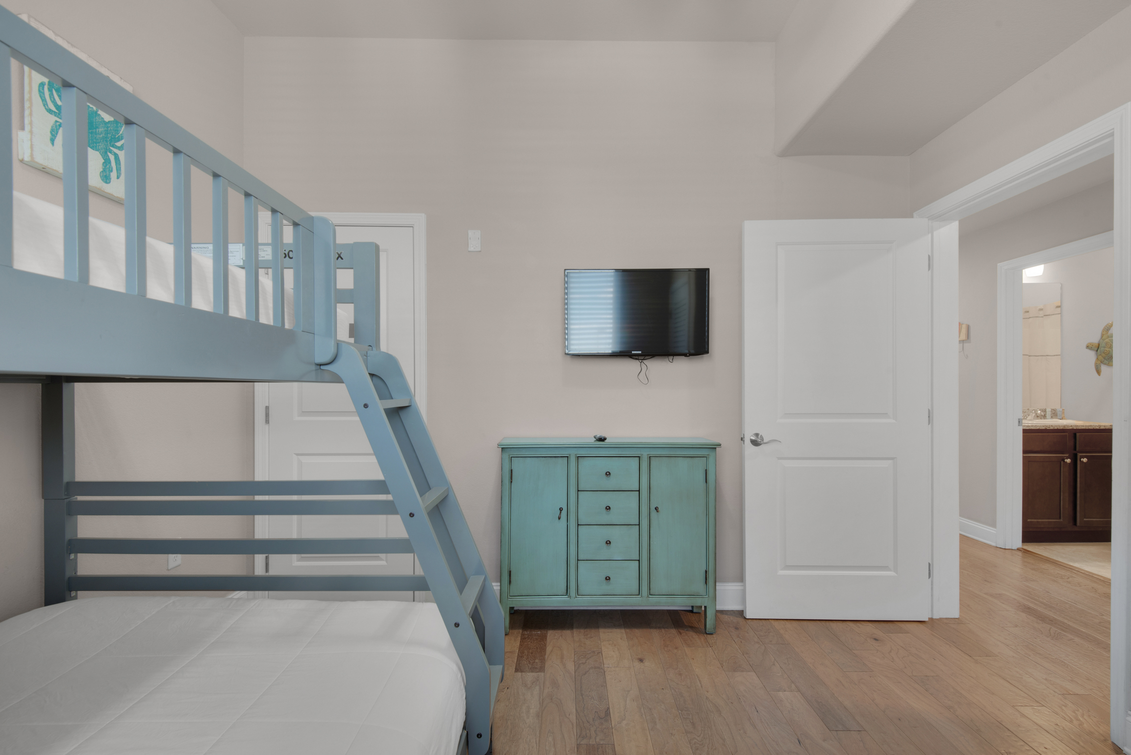 Bunk room with flat screen TV