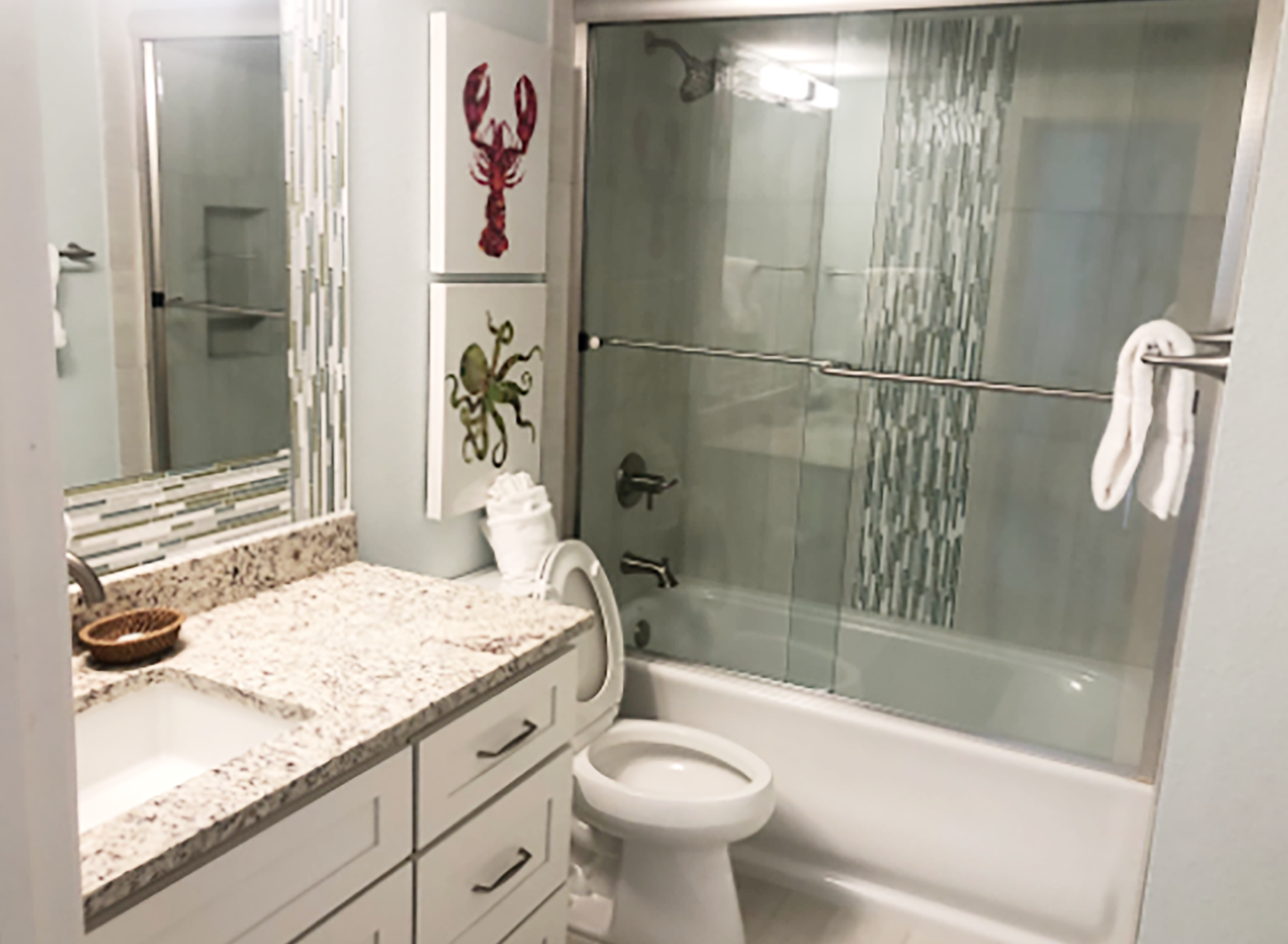 Full guest bath with shower-tub combo