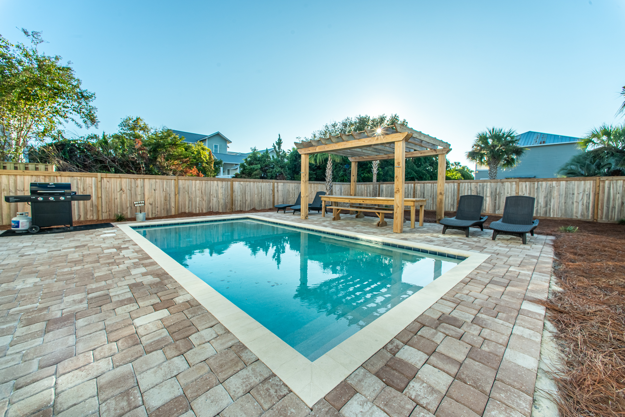 Beautiful Pool Deck with Lounges and Grill