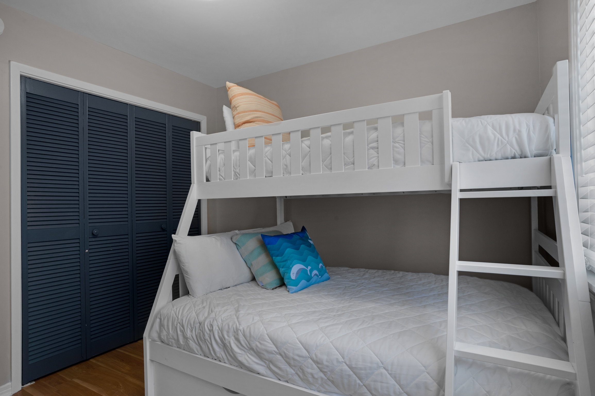 Bunk bedroom has a twin over full and trundle bed