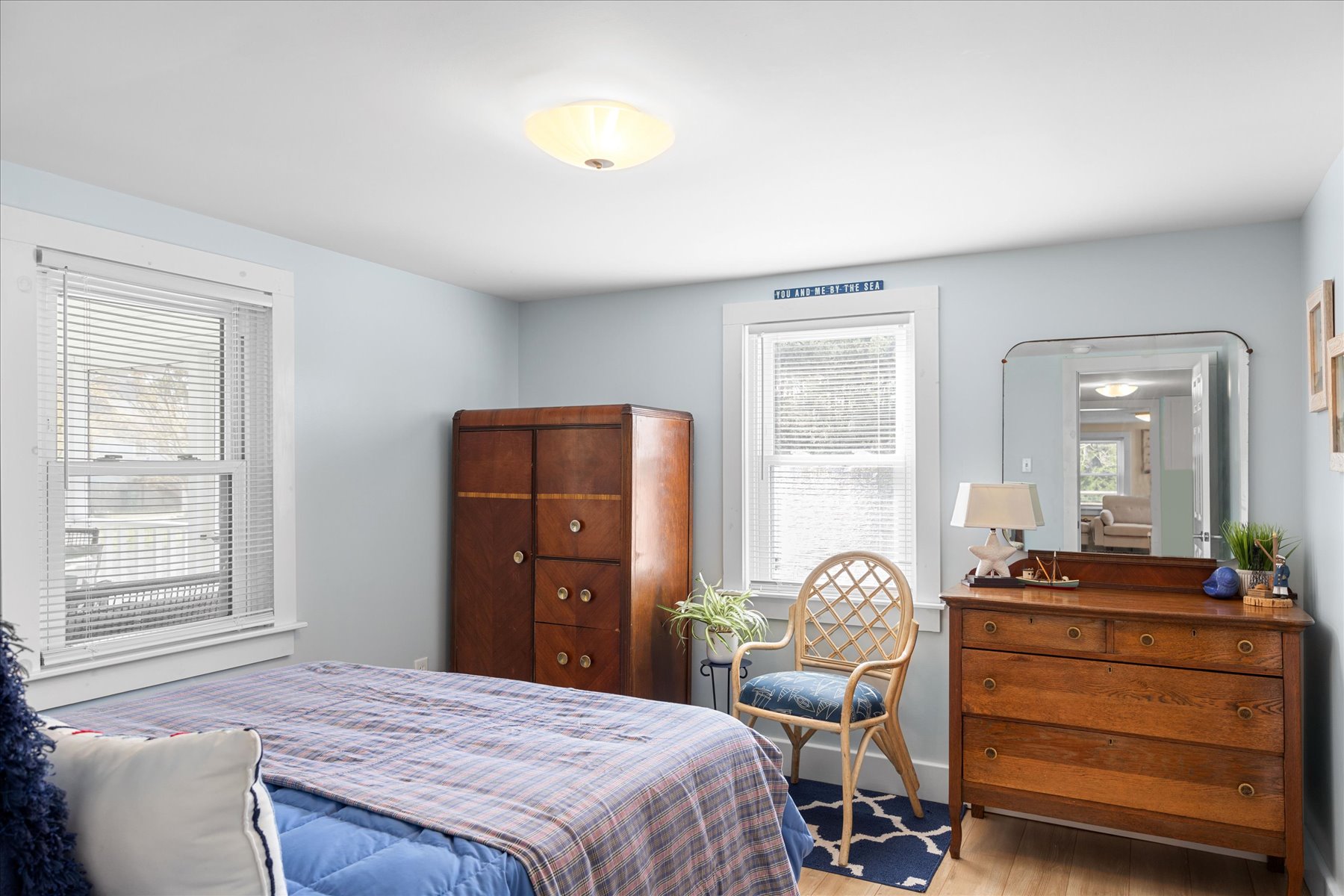 Bedroom 1 has a fun Nautical Theme and beachy blues.