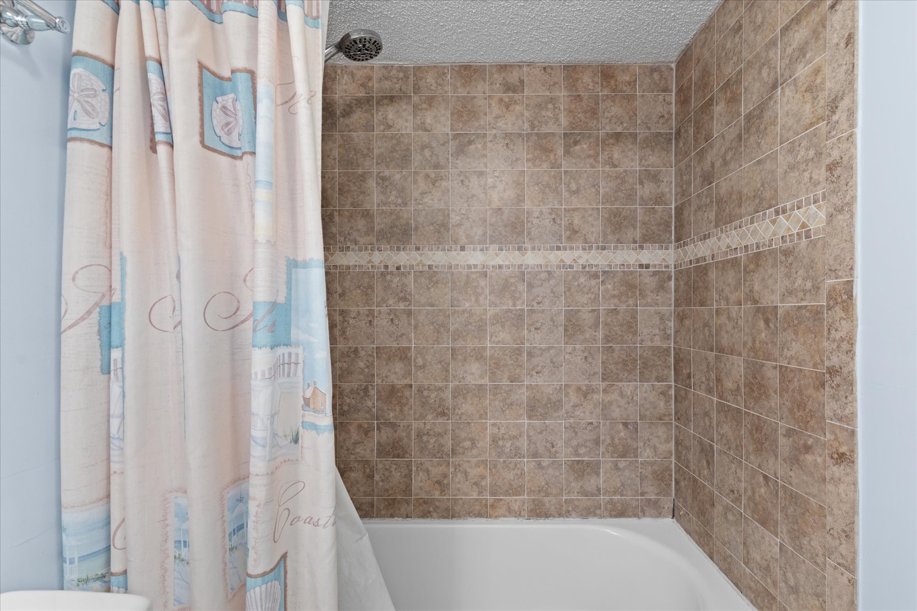 Features a Shower/Tub combo.