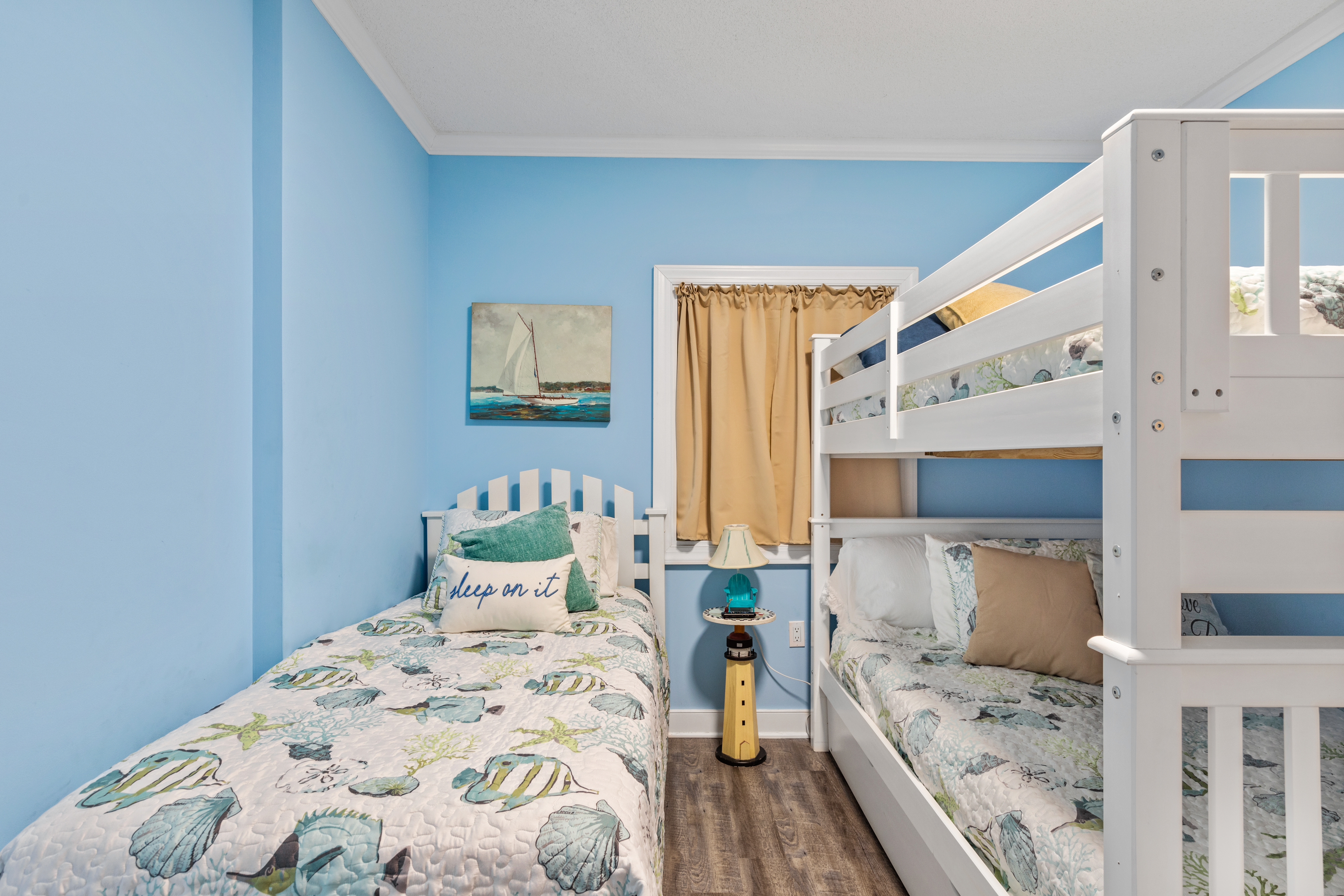 This Bedroom features a Full Bunk Bed and a Twin Bed.