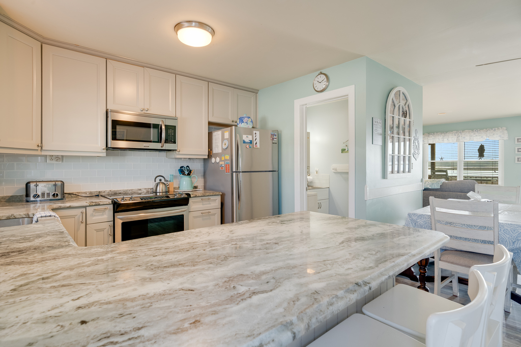 Solid Surface Countertops and Stainless Appliances.