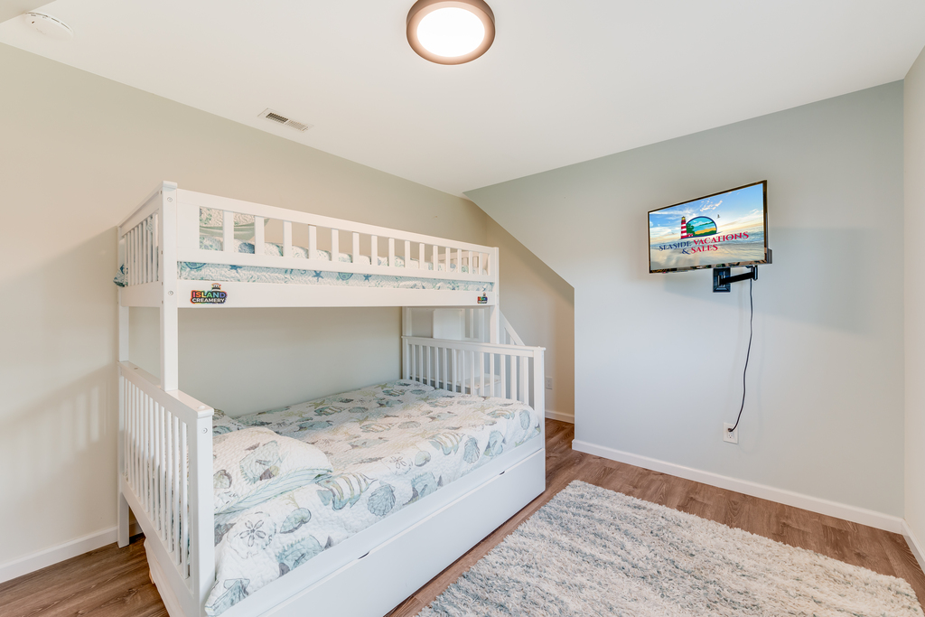 Bedroom 3 sleeps 4 with a Pyramid Bunk (Twin over Full) and a Twin Trundle Bed.